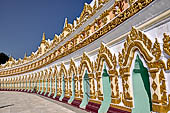 Myanmar - Sagaing, Umin Thounzeh (the 30 Caves), a colourful crescent-shaped colonnade within which there are 45 Buddha images. 